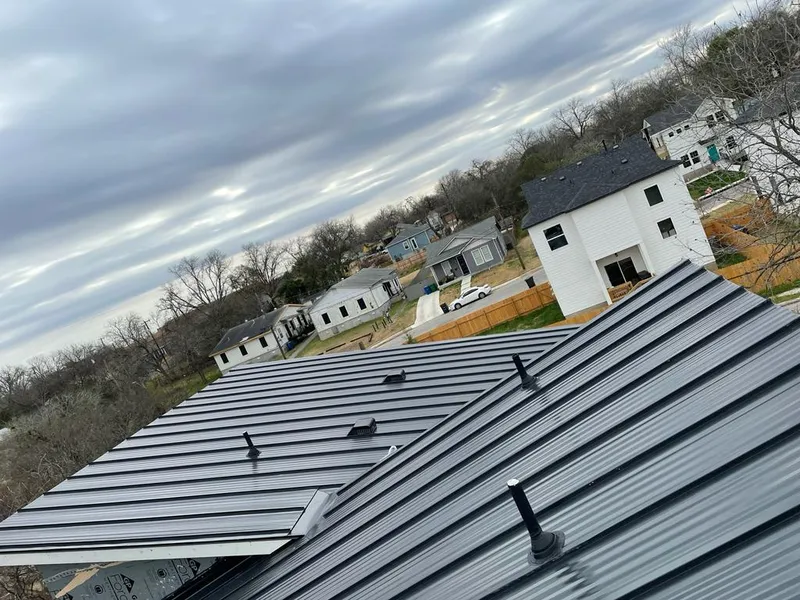 Standing seam metal roof panels with vents for Skylight Repair in Taos